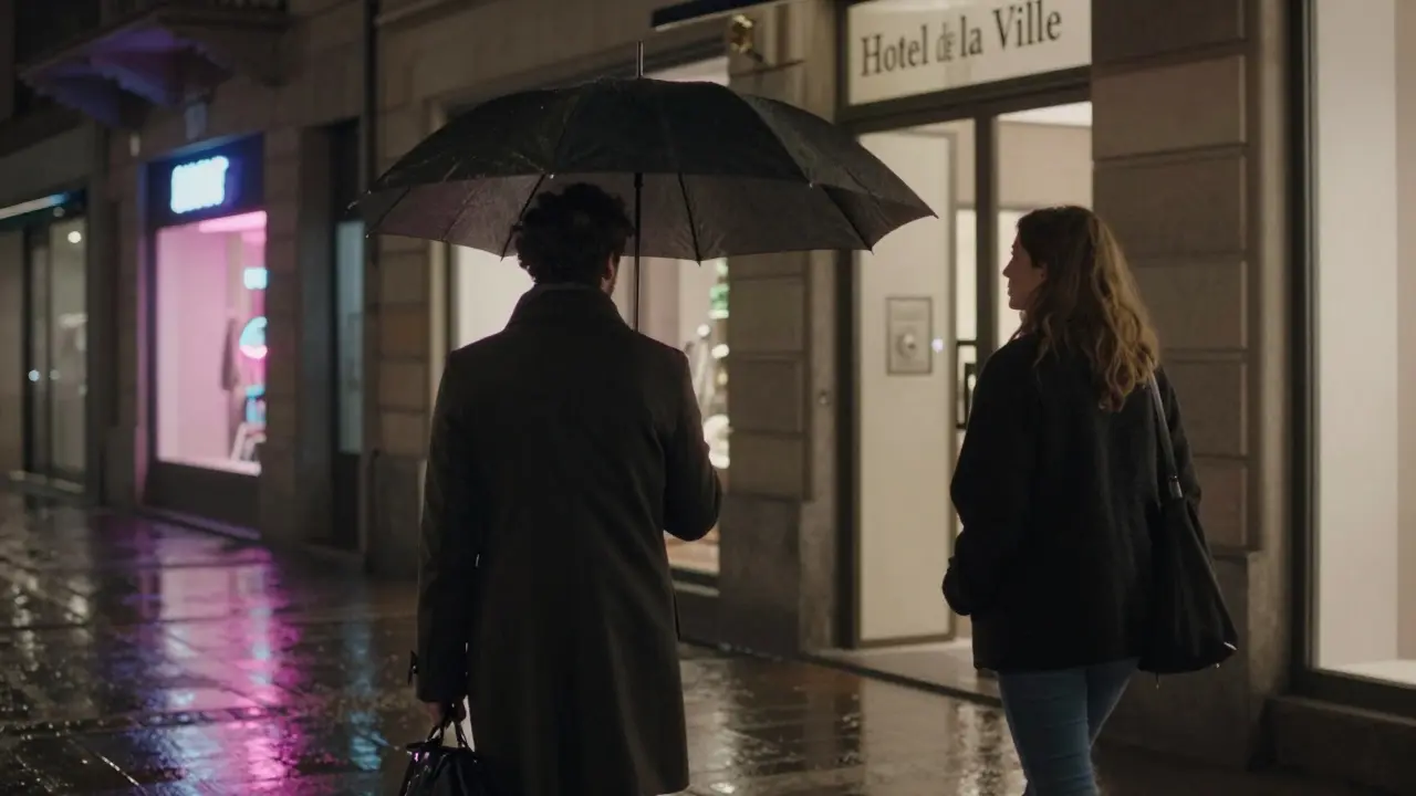 A man and woman walk together under an umbrella in rainy Milan, heading toward a hotel, exuding quiet mutual respect.
